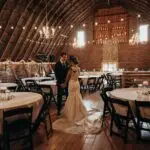 Wedding couple inside an elegant reception venue — ideal for planning transportation for large wedding parties in San Diego.